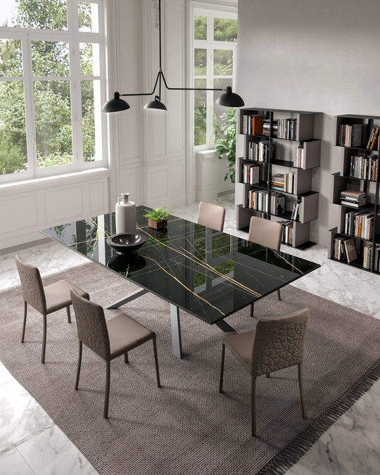 Modern dining room with the 4x4 glass dining table and chairs in a well-lit room.