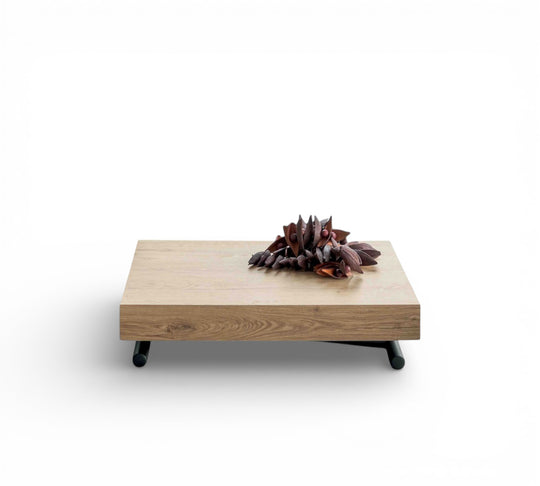 Boxy Small wooden coffee table with decorative items on a white background