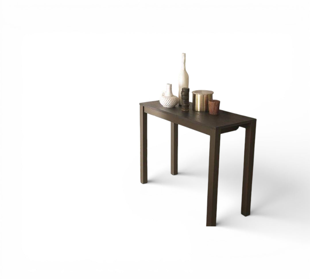 Quebec dark wooden table with decorative items on a white background