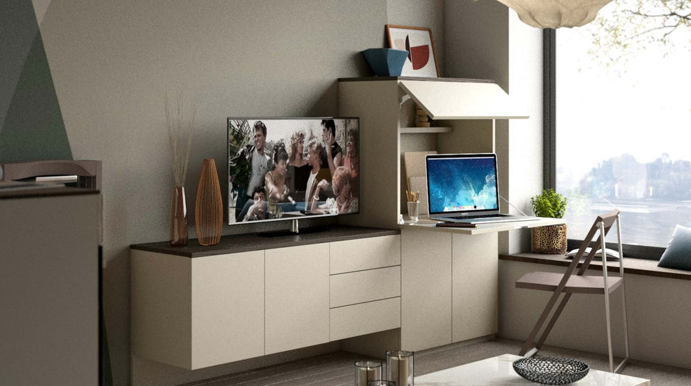 Modern living room with a TV on a stand and a laptop on the Smart Office.