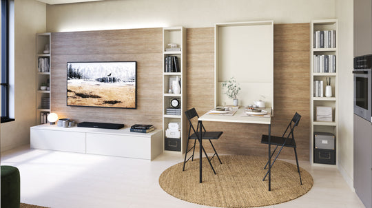 Modern living room with a TV, bookshelves, and a foldaway Odil dining table.

Details