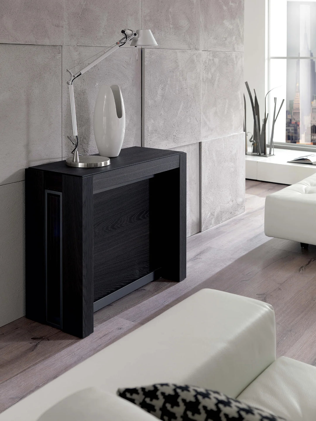 Modern living room with a black A4 console table and white sofa.