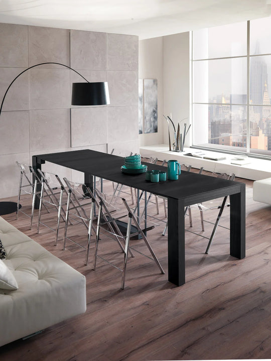 Modern dining room with a black A4 console table and chairs in a well-lit room.