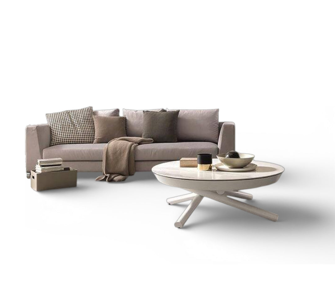 Modern grey sofa with the Concept Round coffee table in a minimalistic setting