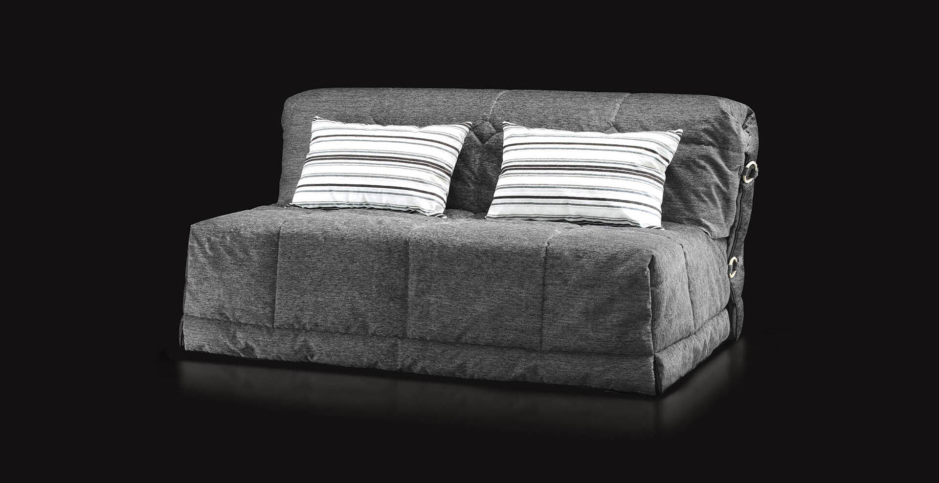 Grey Gil sofa with striped cushions on a black background