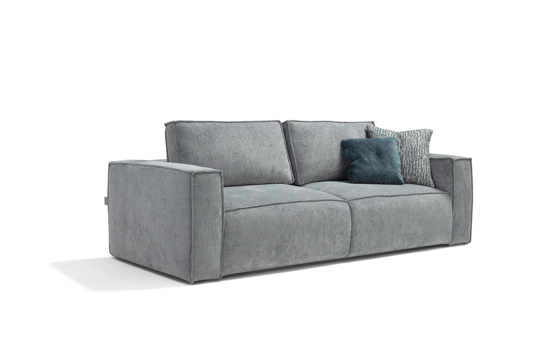 Gray sofa with cushions on a white background