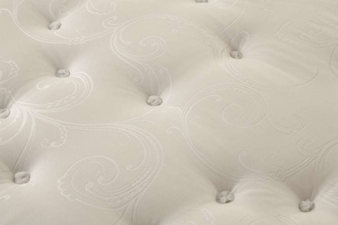 Close-up of the Superb mattress with tufted design