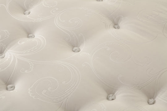Close-up of the Superb mattress with tufted design