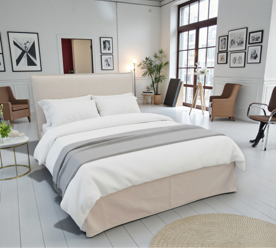 Shabby Chic storage bed Nnatly made bed with white and grey bedding in a modern bedroom.