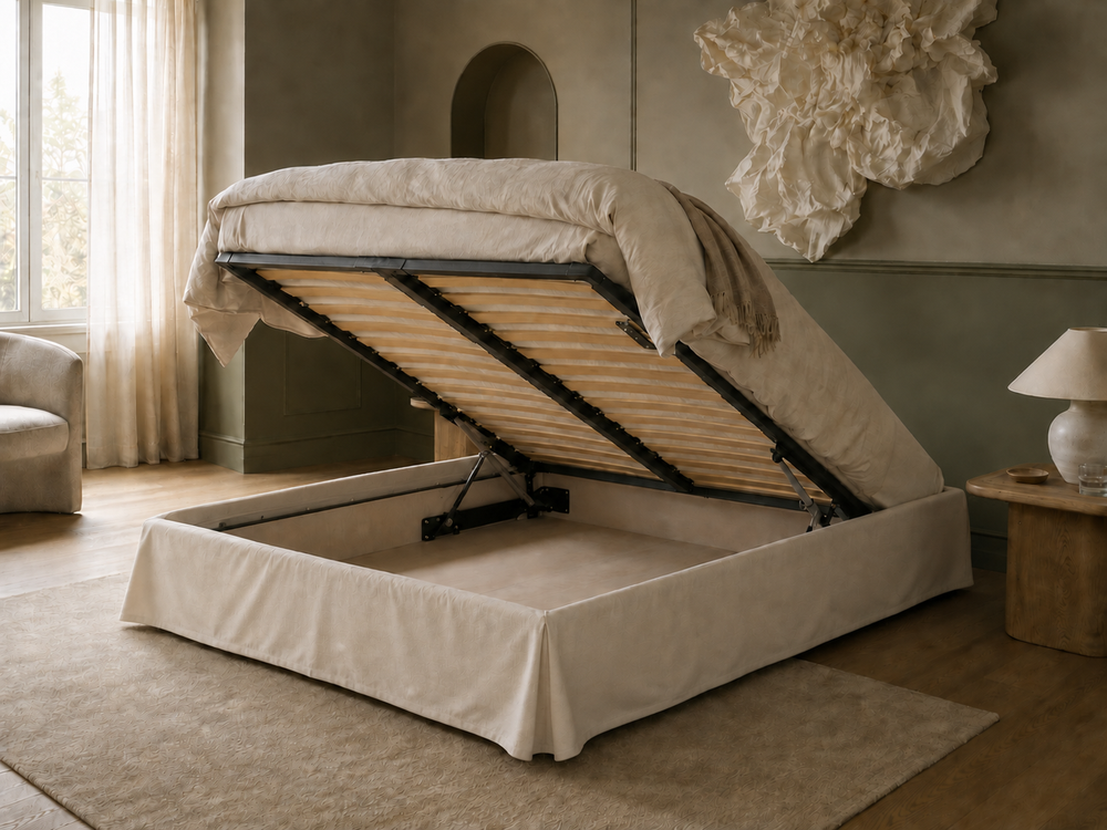 Ted Shabby chic a low-profile storage bed with a lift-up mattress base, dressed in neutral beige bedding, set in a styled bedroom with a rug, side table, and lamp.