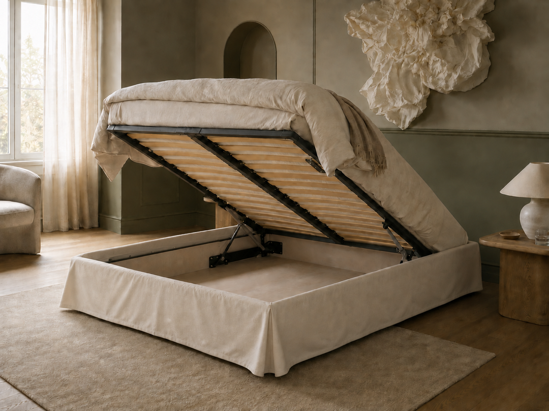 Ted Shabby chic a low-profile storage bed with a lift-up mattress base, dressed in neutral beige bedding, set in a styled bedroom with a rug, side table, and lamp.