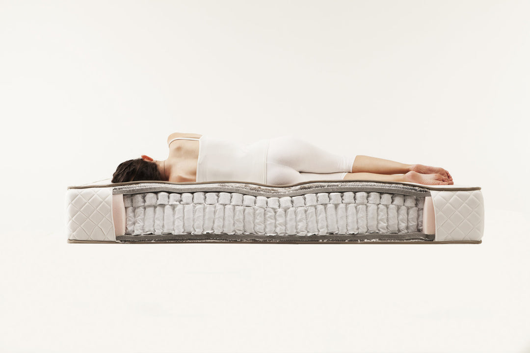 Person lying on a Superb mattress with a white background